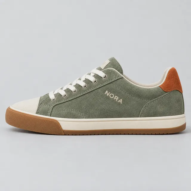 Product photo of a sage green suede sneaker